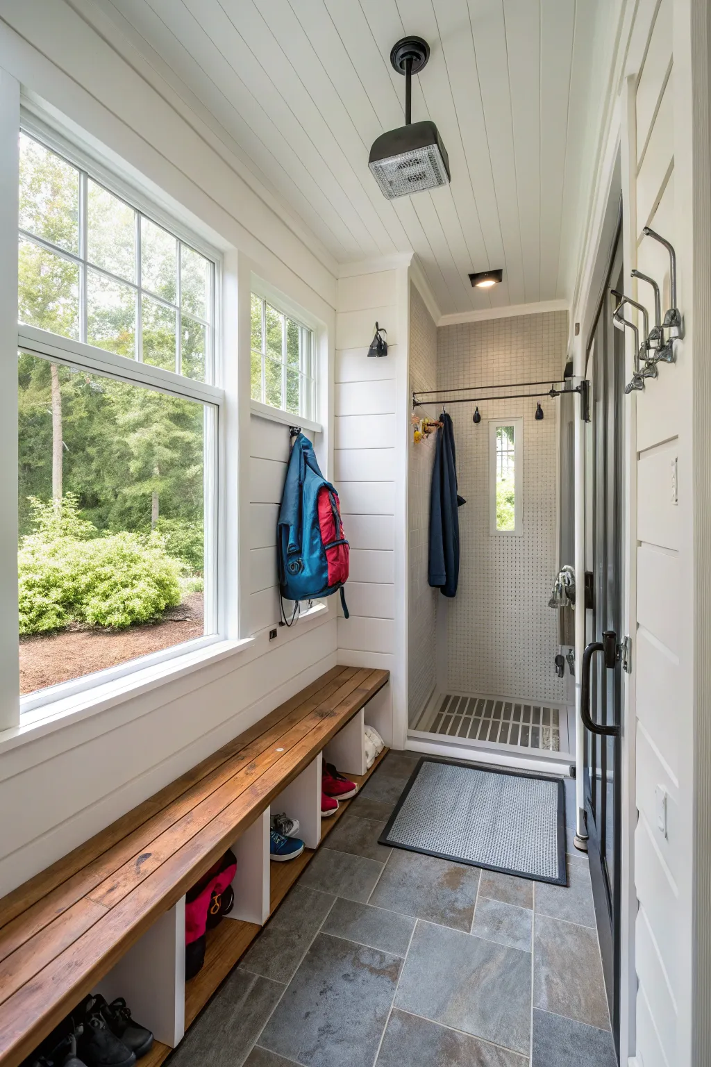 A mudroom with a shower designed for rinsing off after outdoor activities.