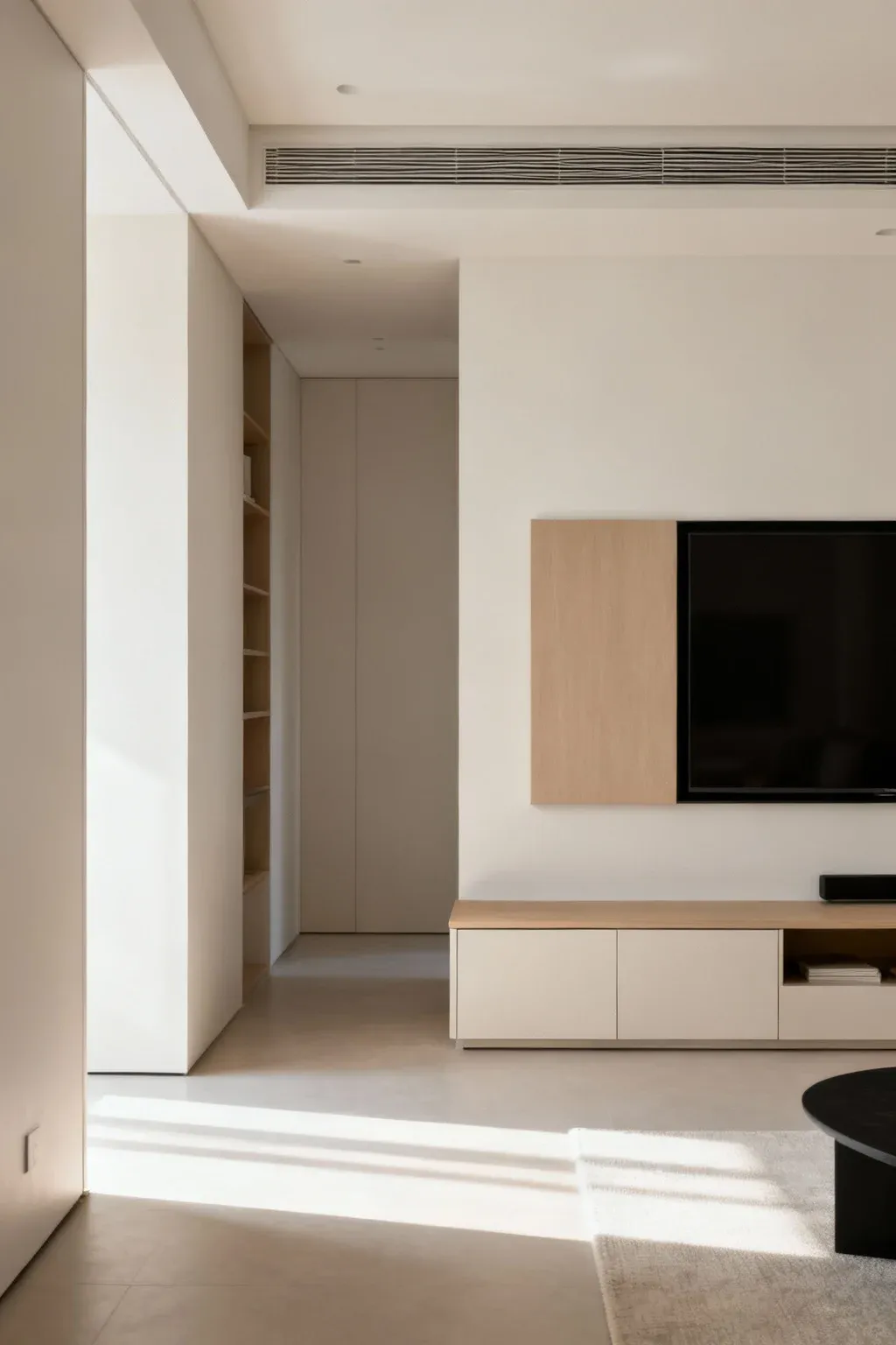 Contemporary apartment TV unit with low cabinet and wall-mounted screen