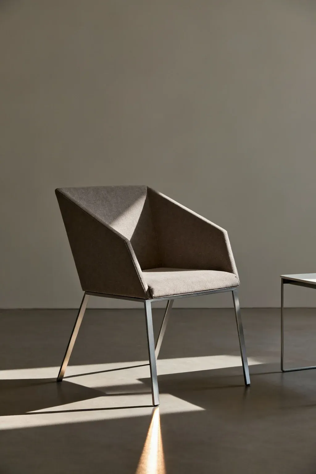Slim sled-base accent chair in modern minimalist living setup