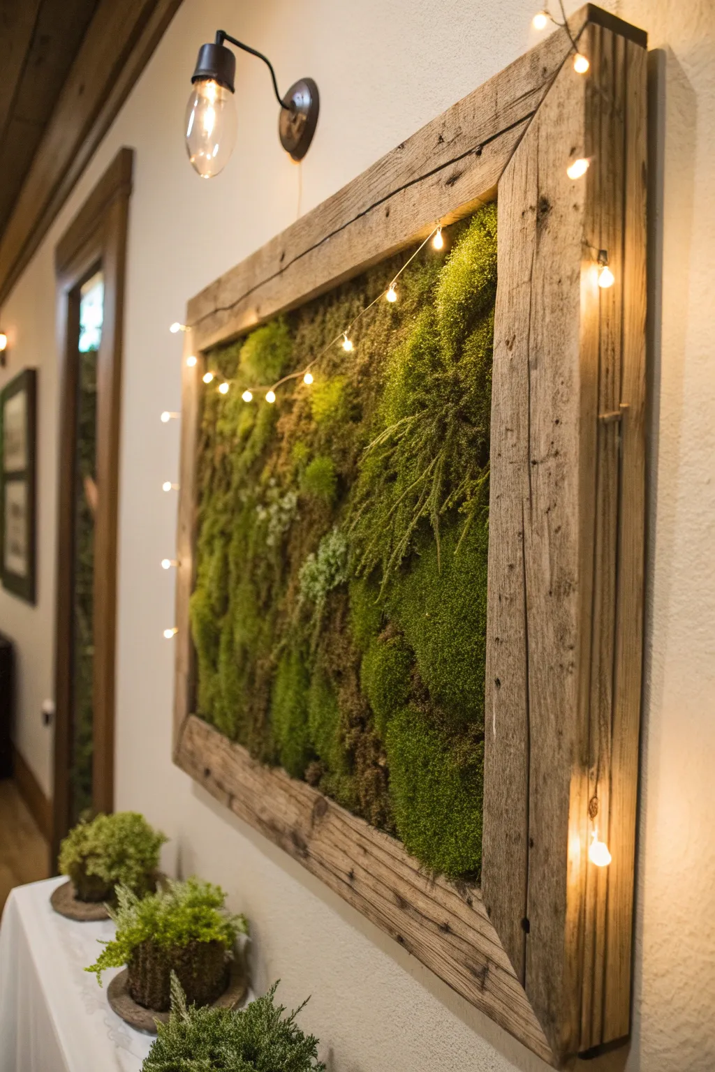 Framed moss wall art with rich textures in soft lighting.