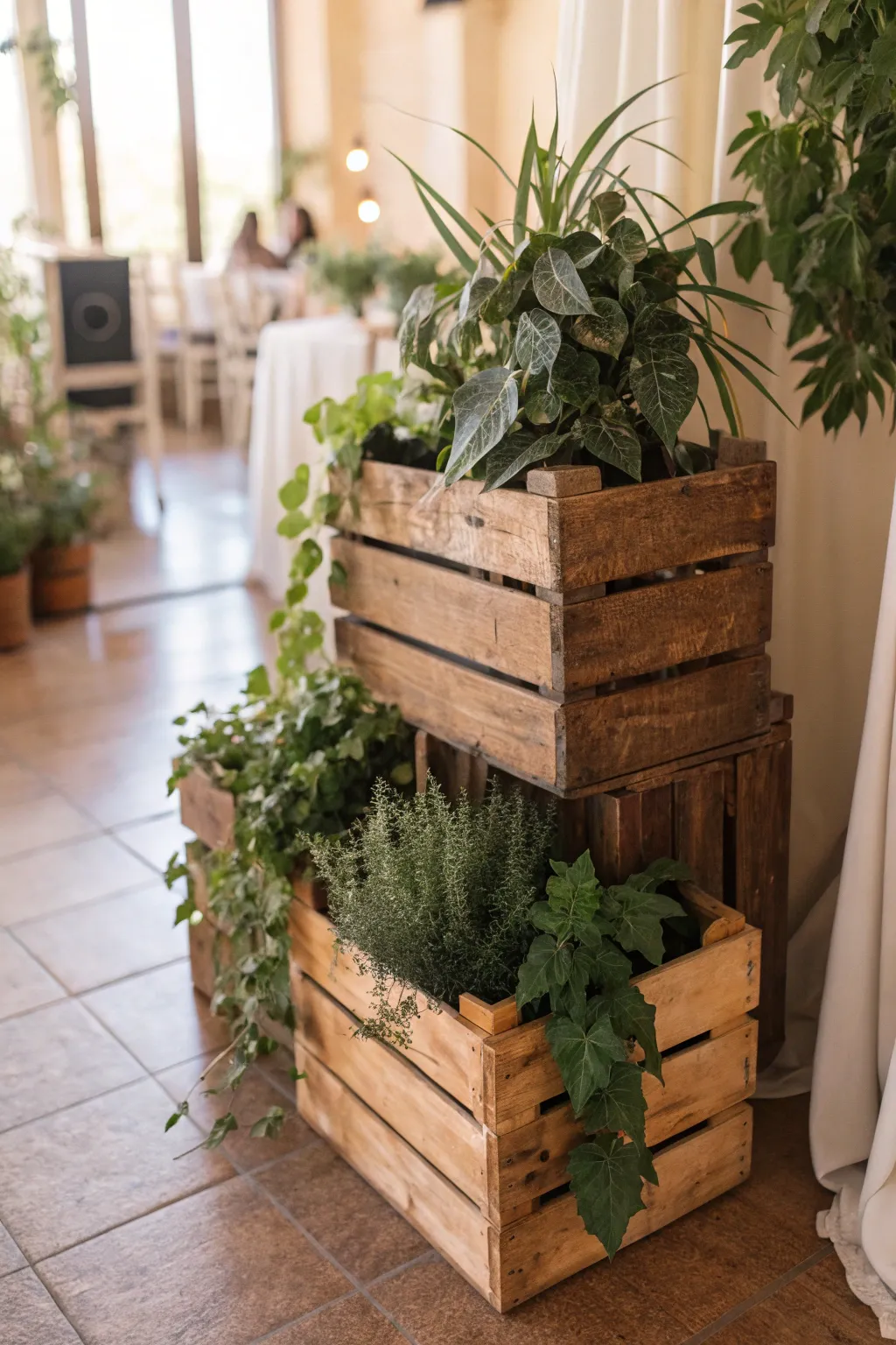 Stacked wooden crates filled with plants in a cozy indoor setting.