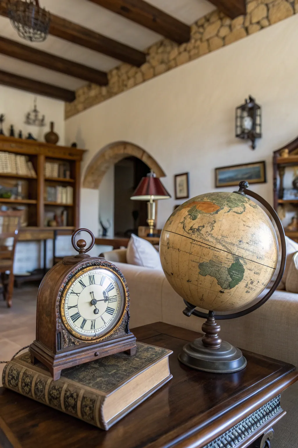 Antique clock and globe on a coffee table.