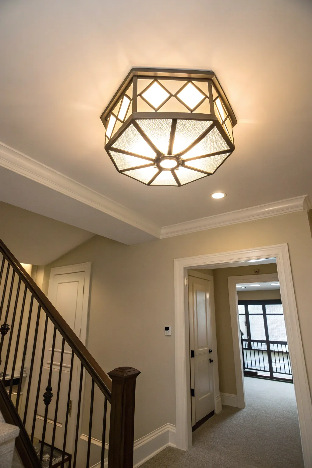 Minimalist flush mount ceiling light in a clean and modern entryway.