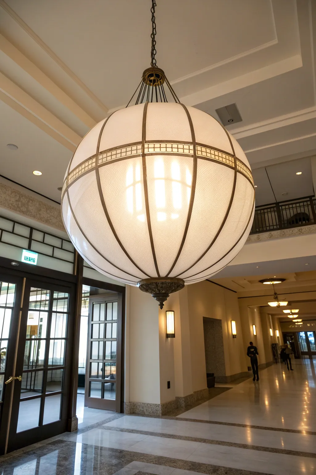Oversized globe pendant light making a bold statement in an entryway.