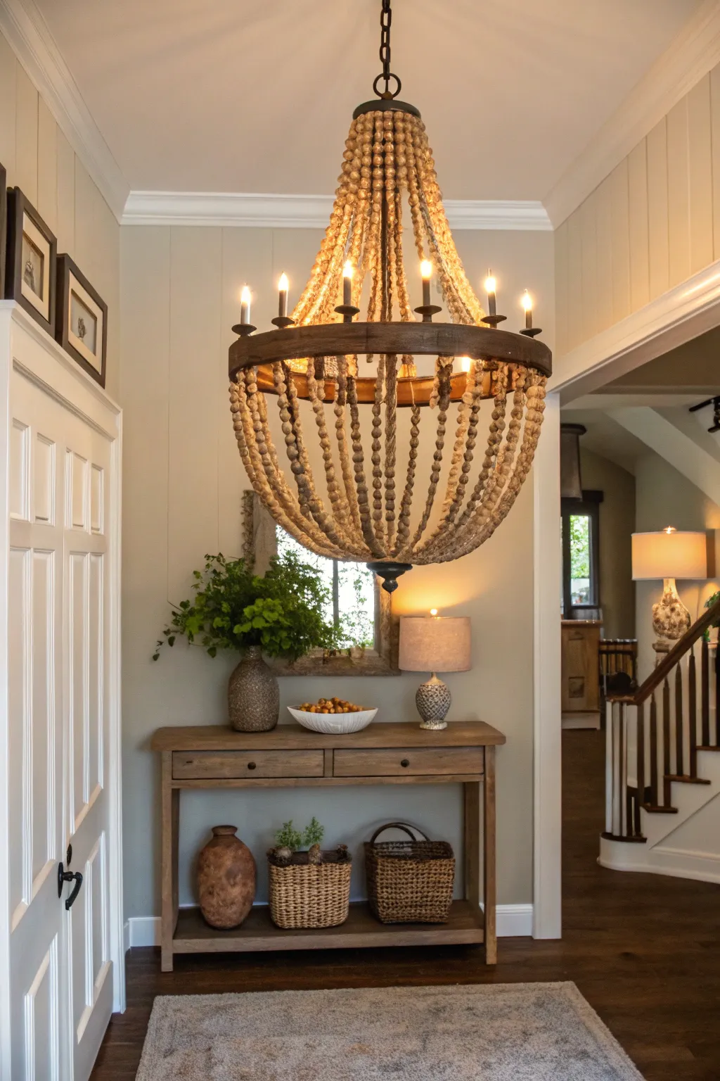 Rustic wood bead chandelier infusing warmth in an entryway.