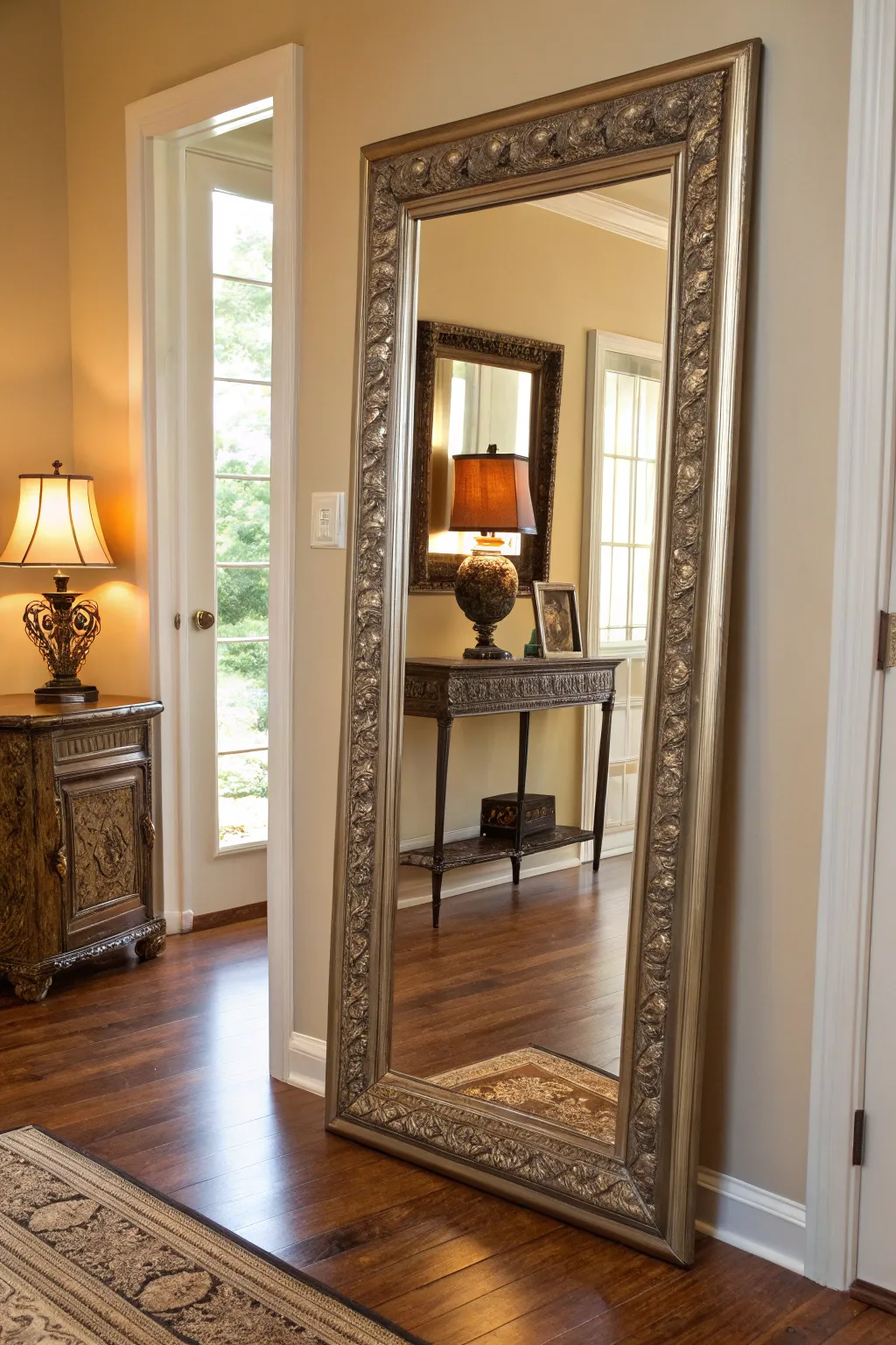 A decorative full-length mirror in an entryway reflecting soft natural light.