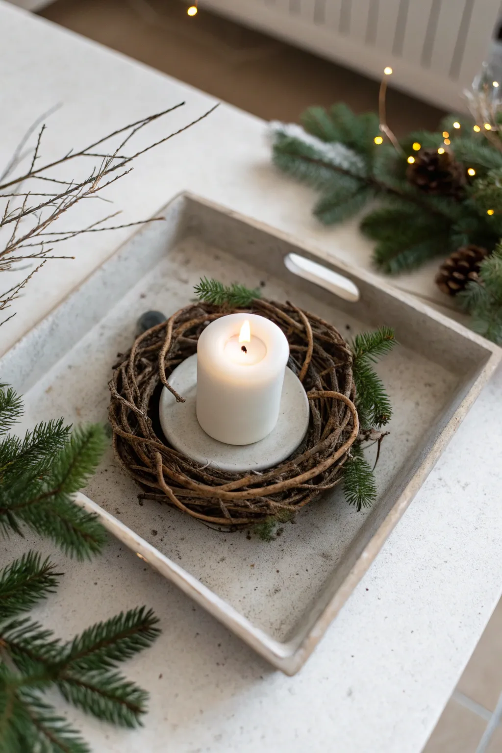 Minimalist tray with a single wreath and white candle in neutral soft lighting.