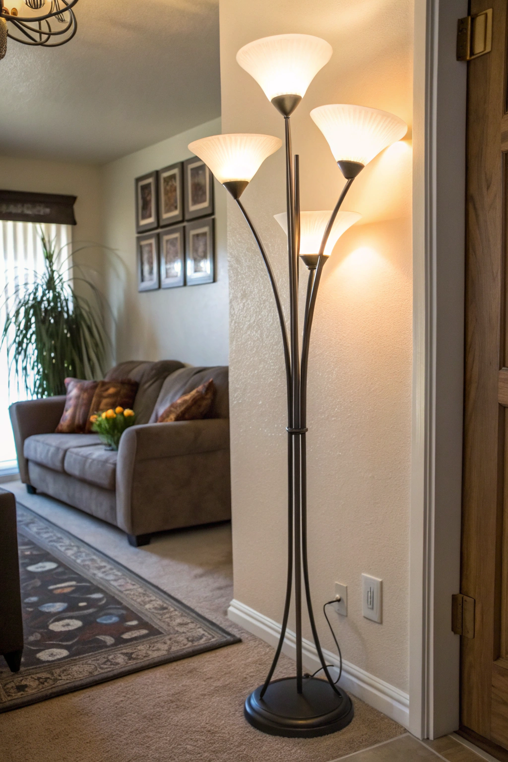 A slim 90s-style tube floor lamp with frosted shades softly lighting a cozy corner.