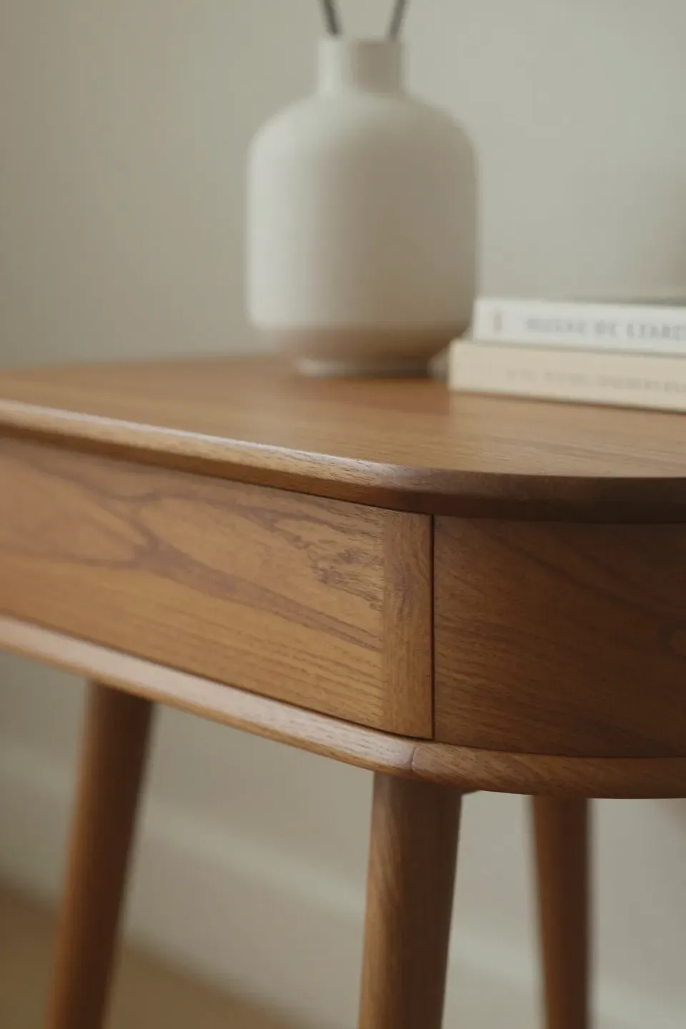 A stylish mid-century modern accent table showcasing sleek lines and rich wood.