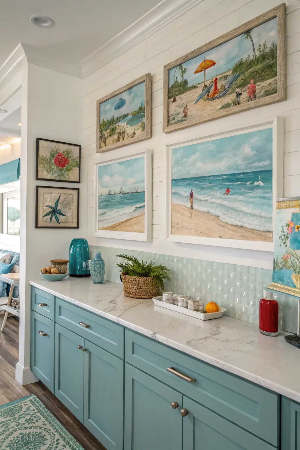 A coastal kitchen with ocean-themed artwork on the walls, enhancing the beachy vibe and inviting atmosphere.