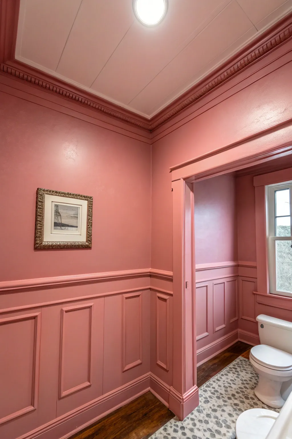 A bathroom with walls and ceiling painted the same shade of soft pink for a monochromatic look.