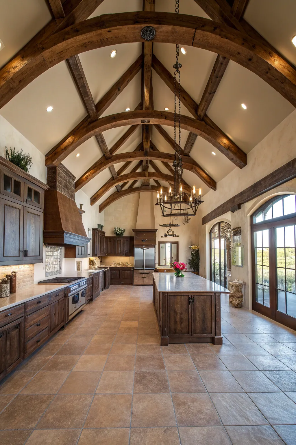 A spacious ranch kitchen featuring heavy dark wood ceiling beams and white walls.