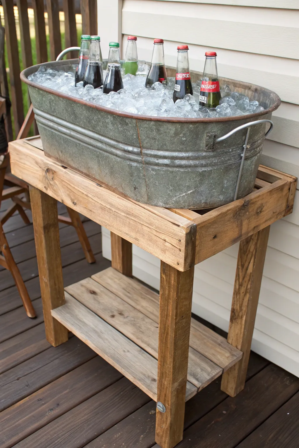 A rustic metal tub drink station on a wooden stand filled with ice and drinks on a patio.