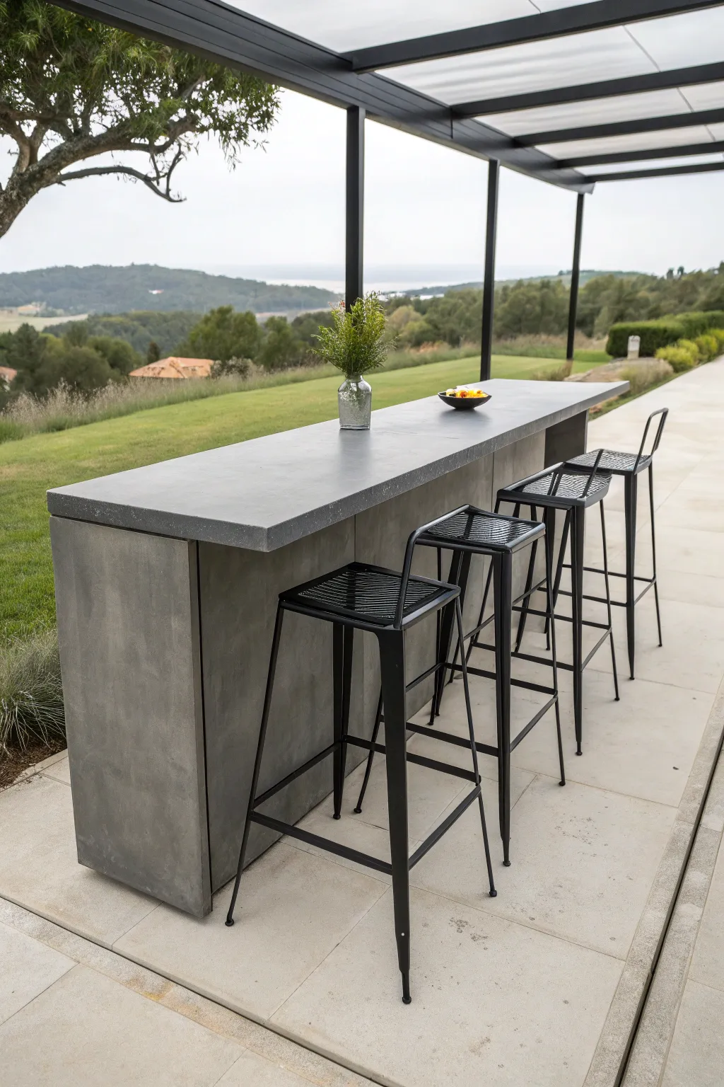 A minimalist matte black metal outdoor bar with matching high stools in a modern garden.