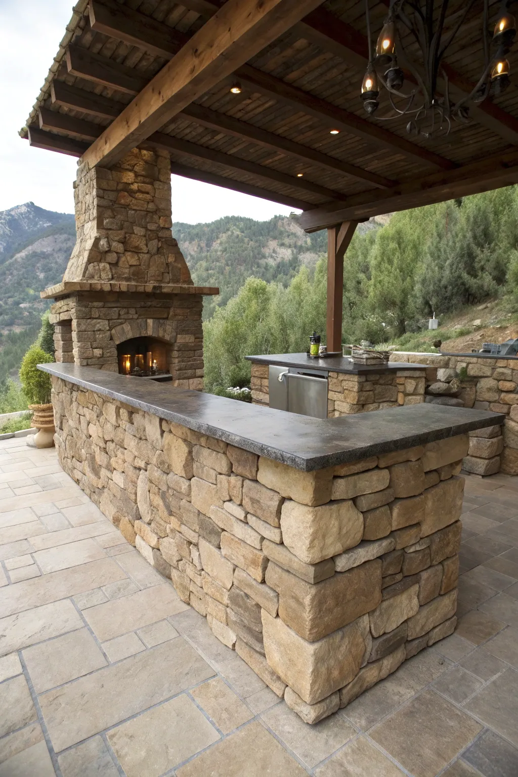 A natural stacked flagstone bar with a dark slate countertop in a garden setting.