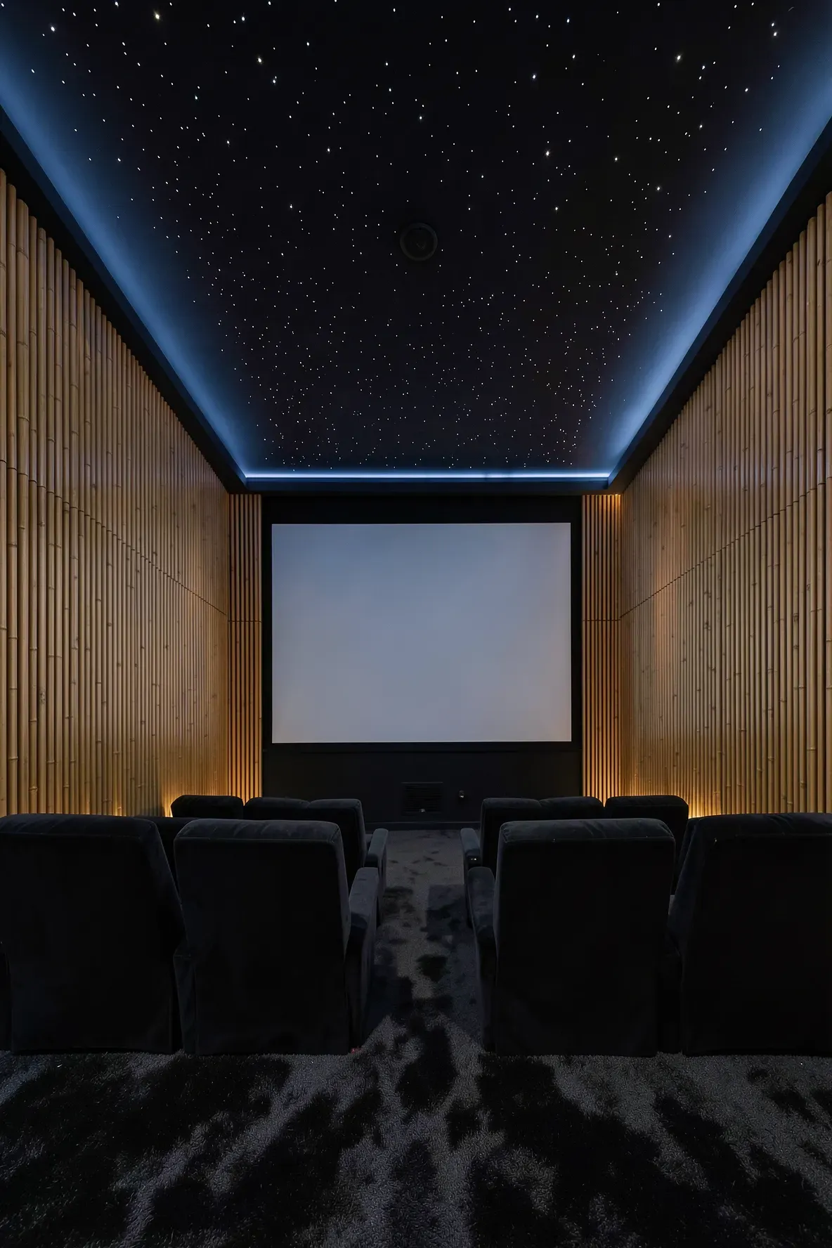 A luxury home theater with fluted bamboo wall panels designed for sound dampening and style.