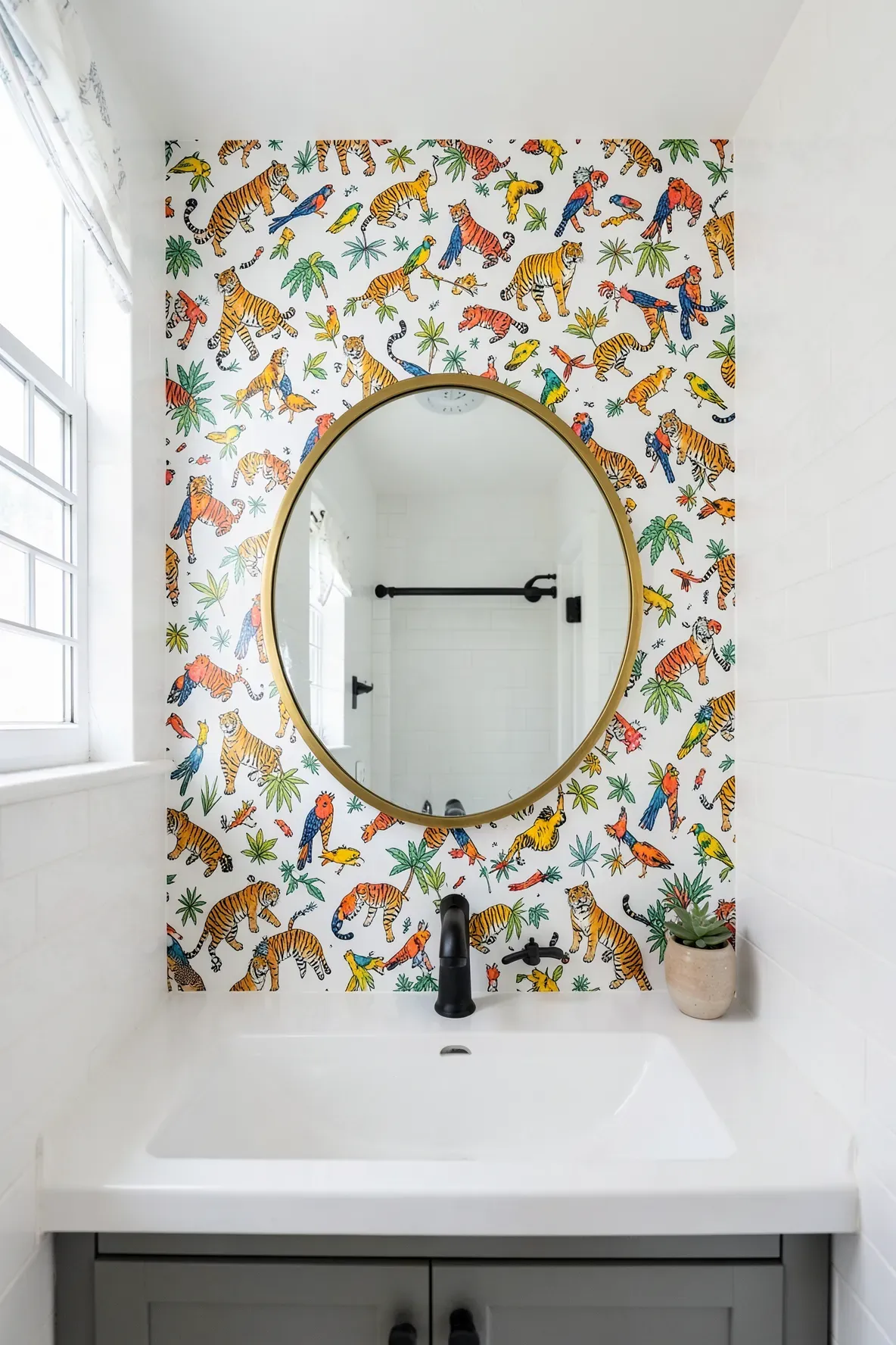 A creative bathroom with a whimsical animal print wallpaper accent wall and modern black fixtures.