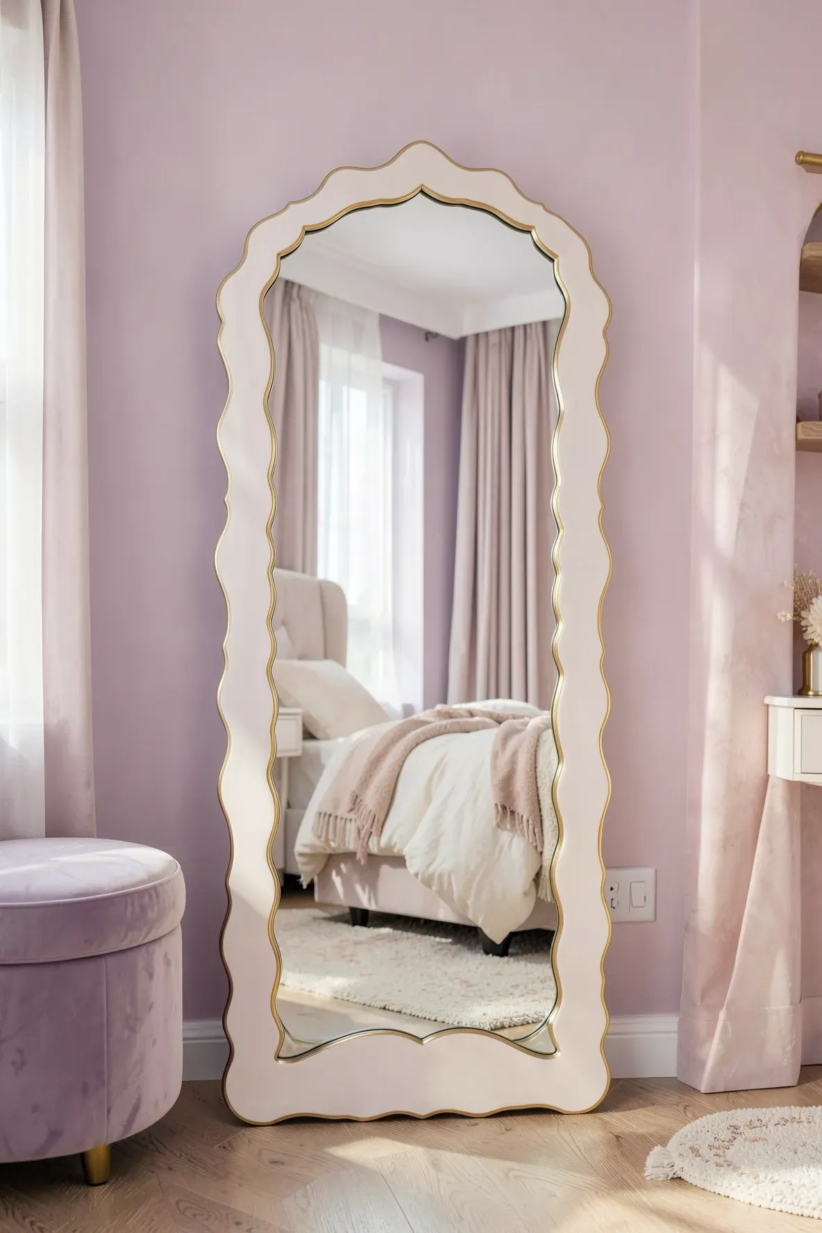 A full-length mirror with wavy scalloped edges in a soft, pastel-colored bedroom setting.