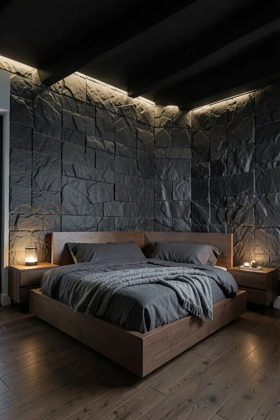 A luxury bedroom featuring a textured black slate accent wall and warm wood furniture.