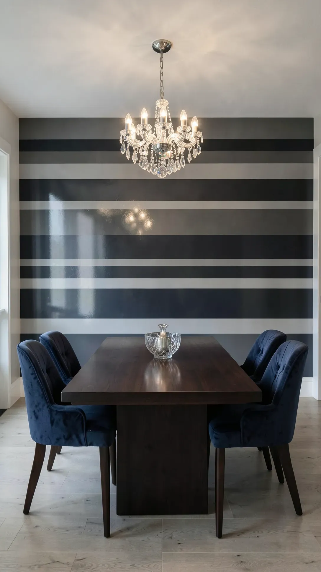 A formal dining room with bold charcoal horizontal stripes in alternating matte and gloss sheens.