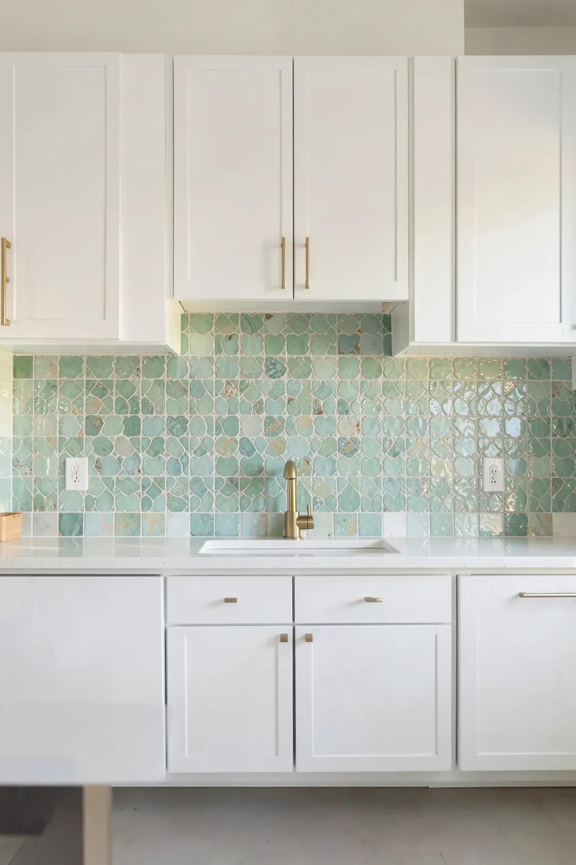 Handmade seafoam green Zellige tile backsplash in a bright modern coastal kitchen.