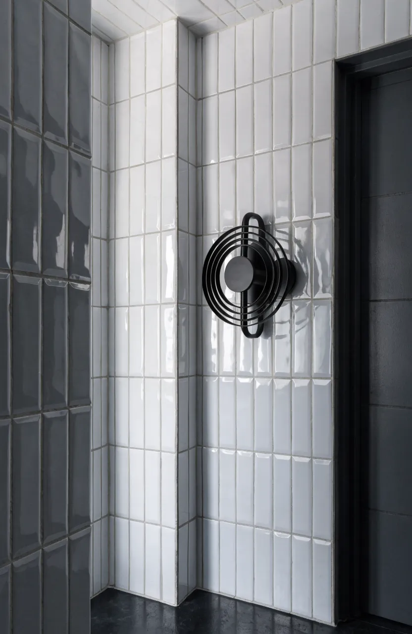 White subway tiles stacked vertically on a bathroom wall to create a sense of height.