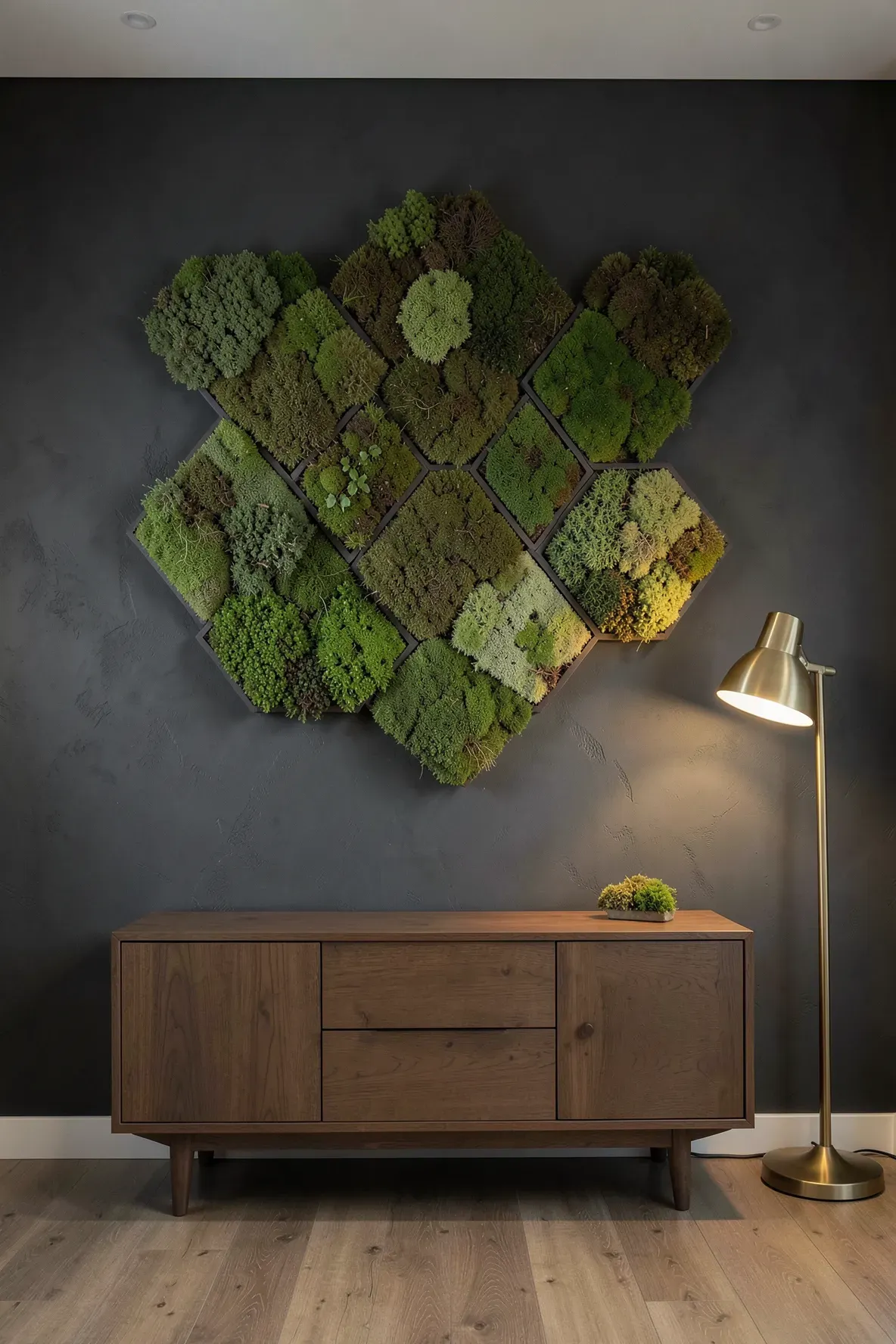 Hexagonal and triangular panels filled with textured green moss arranged on a dark office wall.