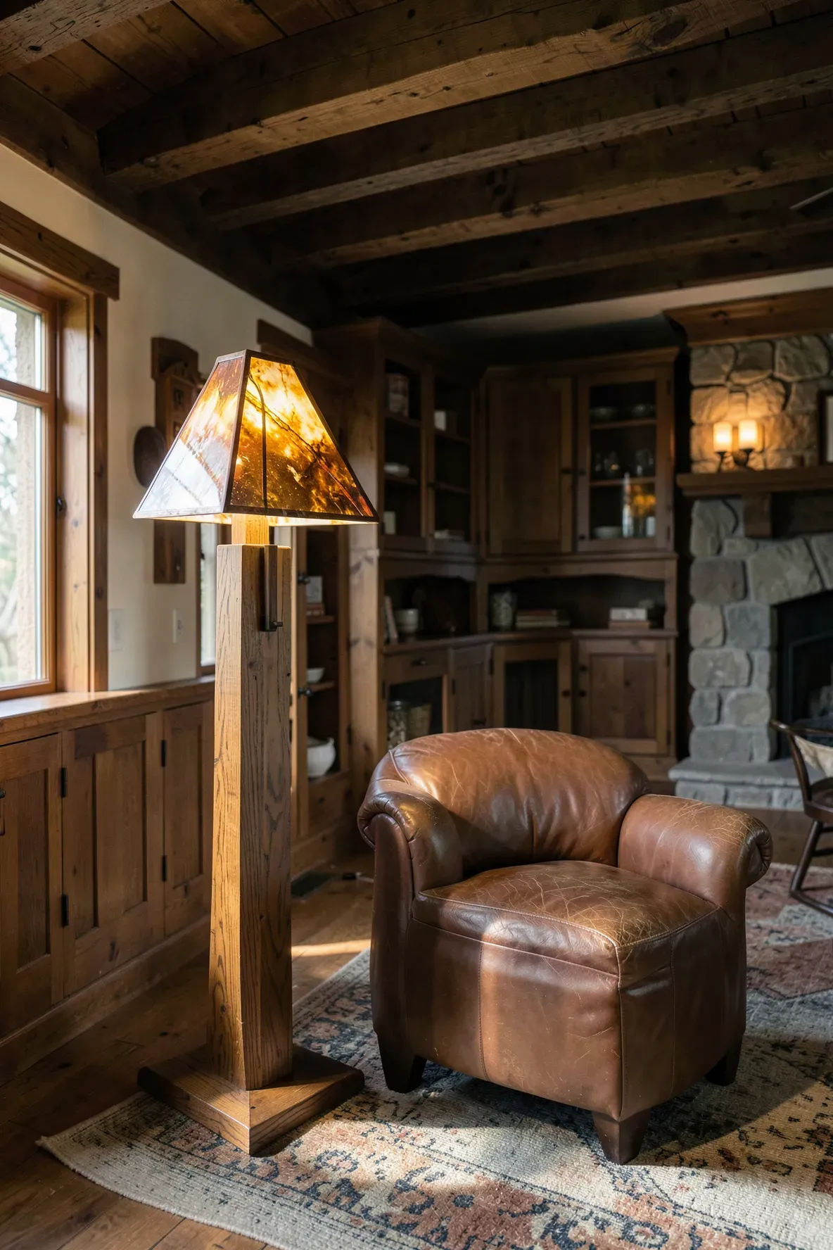 A Mission style oak floor lamp with an amber slag glass shade in a Craftsman living room.