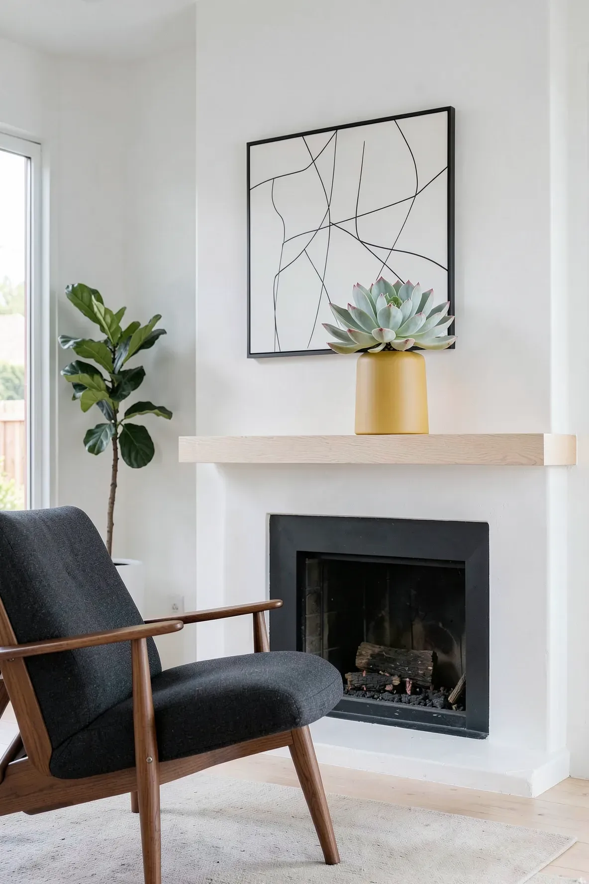 A mustard yellow ceramic pedestal pot with a large Echeveria succulent on a modern wooden mantle.