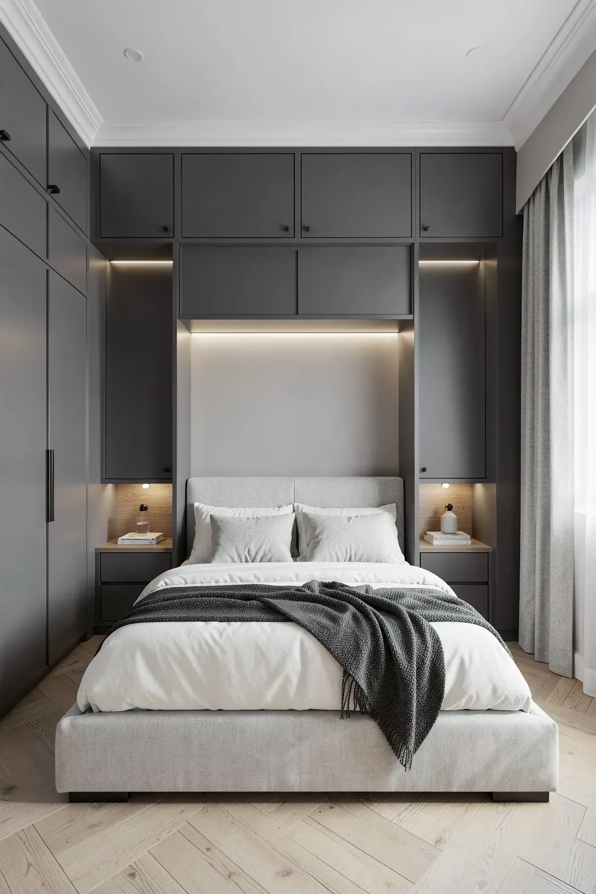 A floor-to-ceiling built-in wardrobe surrounding a bed with separate upper storage cubbies.