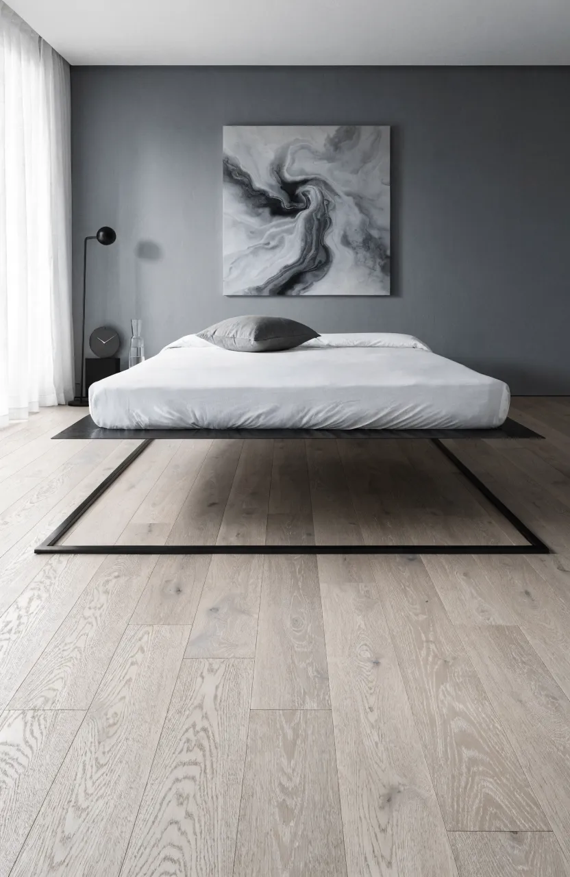 A modern bedroom with a mattress supported by a thin, nearly invisible metal bunkie board.