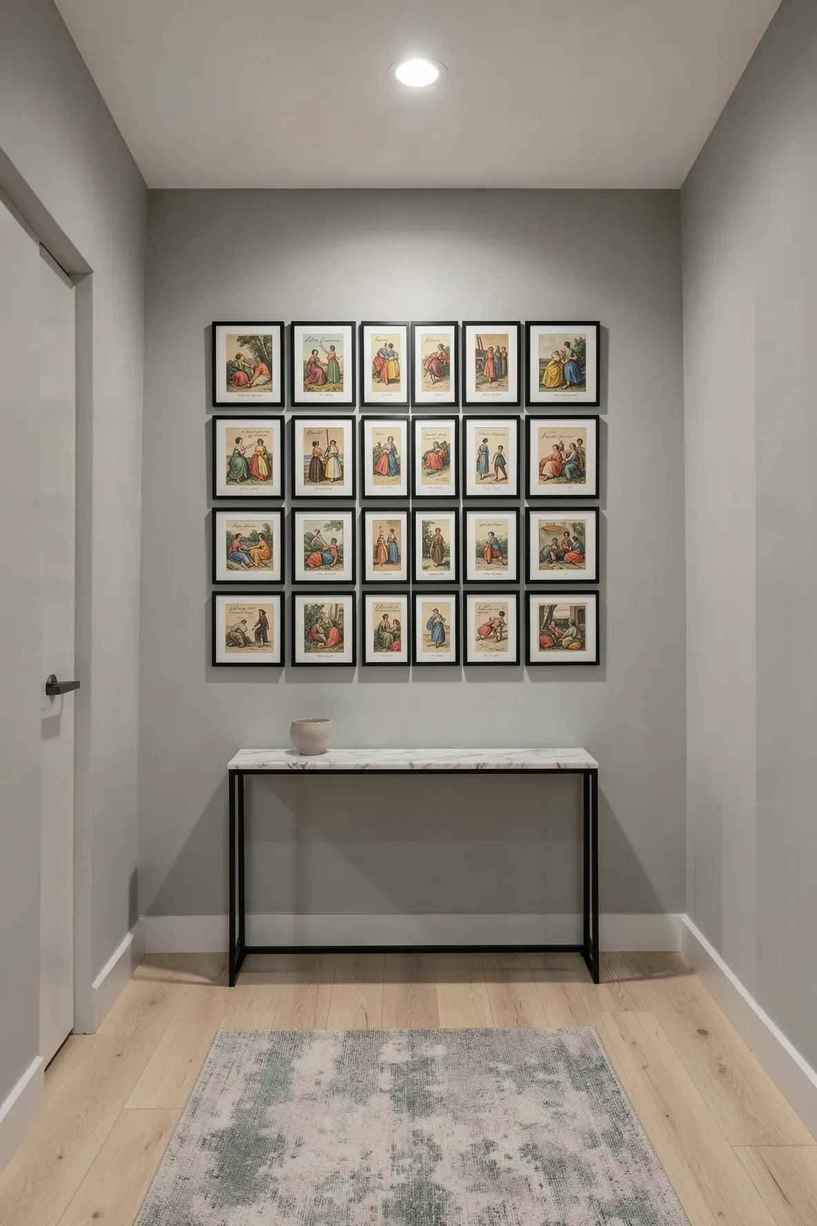 A hallway wall featuring a large, symmetrical grid of vintage postcards in matching black frames.