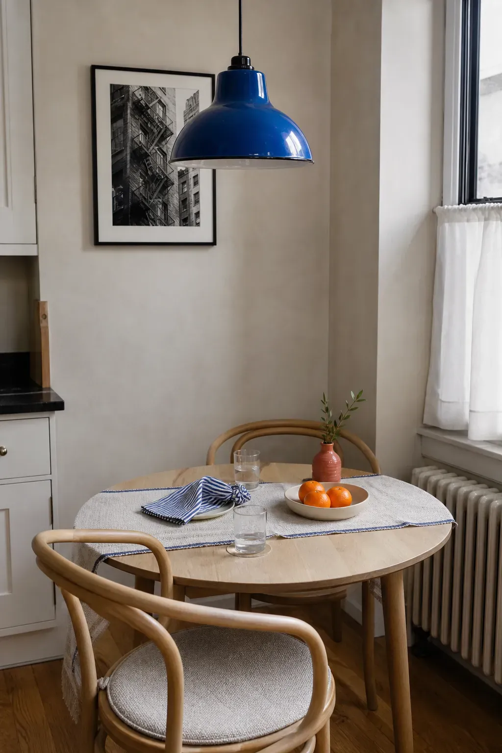 Compact dining nook using cobalt blue with a smaller coral accent