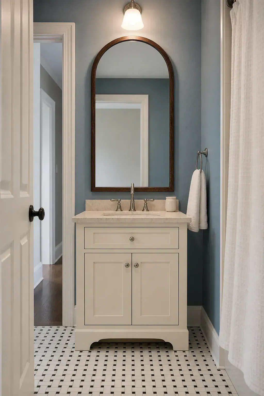Framed mirror creating a focal point above a guest vanity