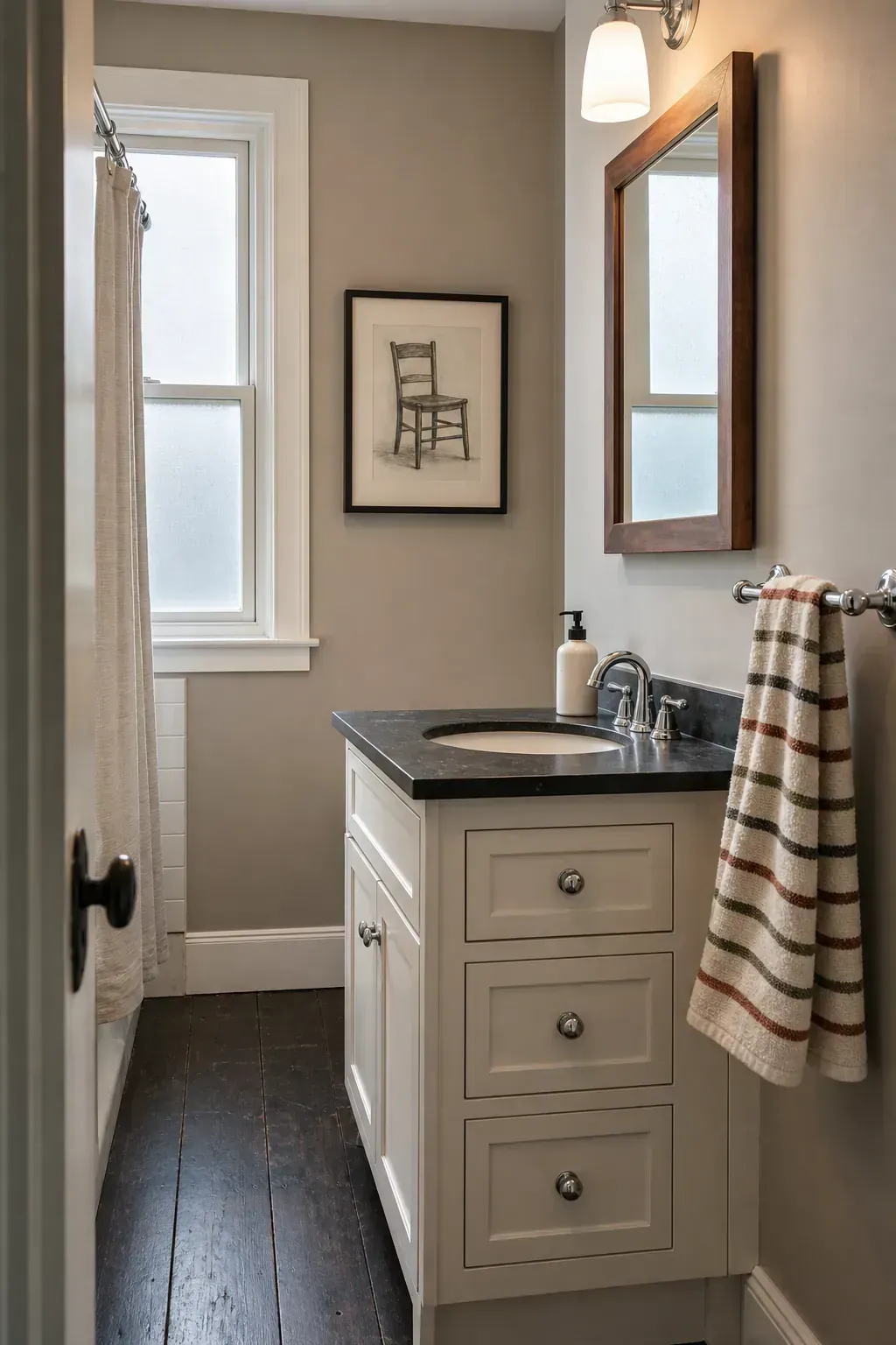 Seasonal striped hand towel refreshing a simple guest vanity