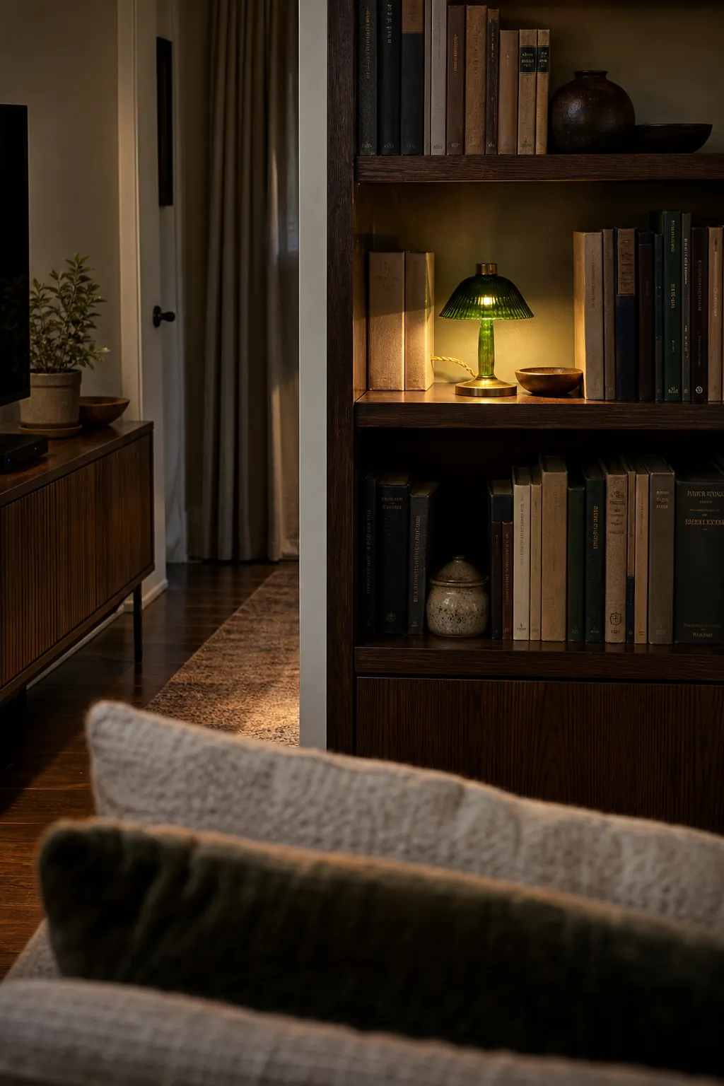 Small shelf lamp adding depth behind living room seating