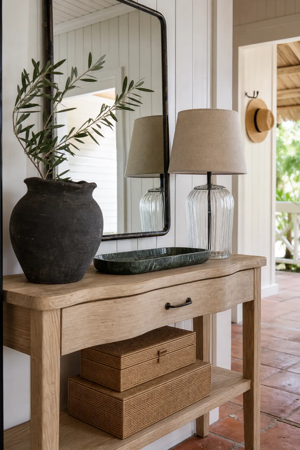 Entryway console styled with ceramic woven glass and dark metal textures