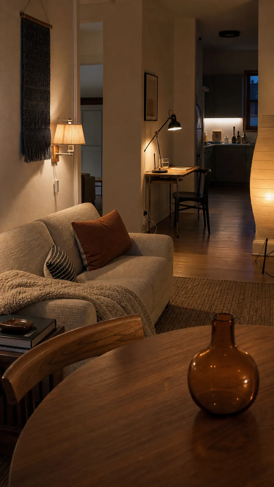 Warm apartment aesthetic created with layered renter-friendly lighting and natural textures