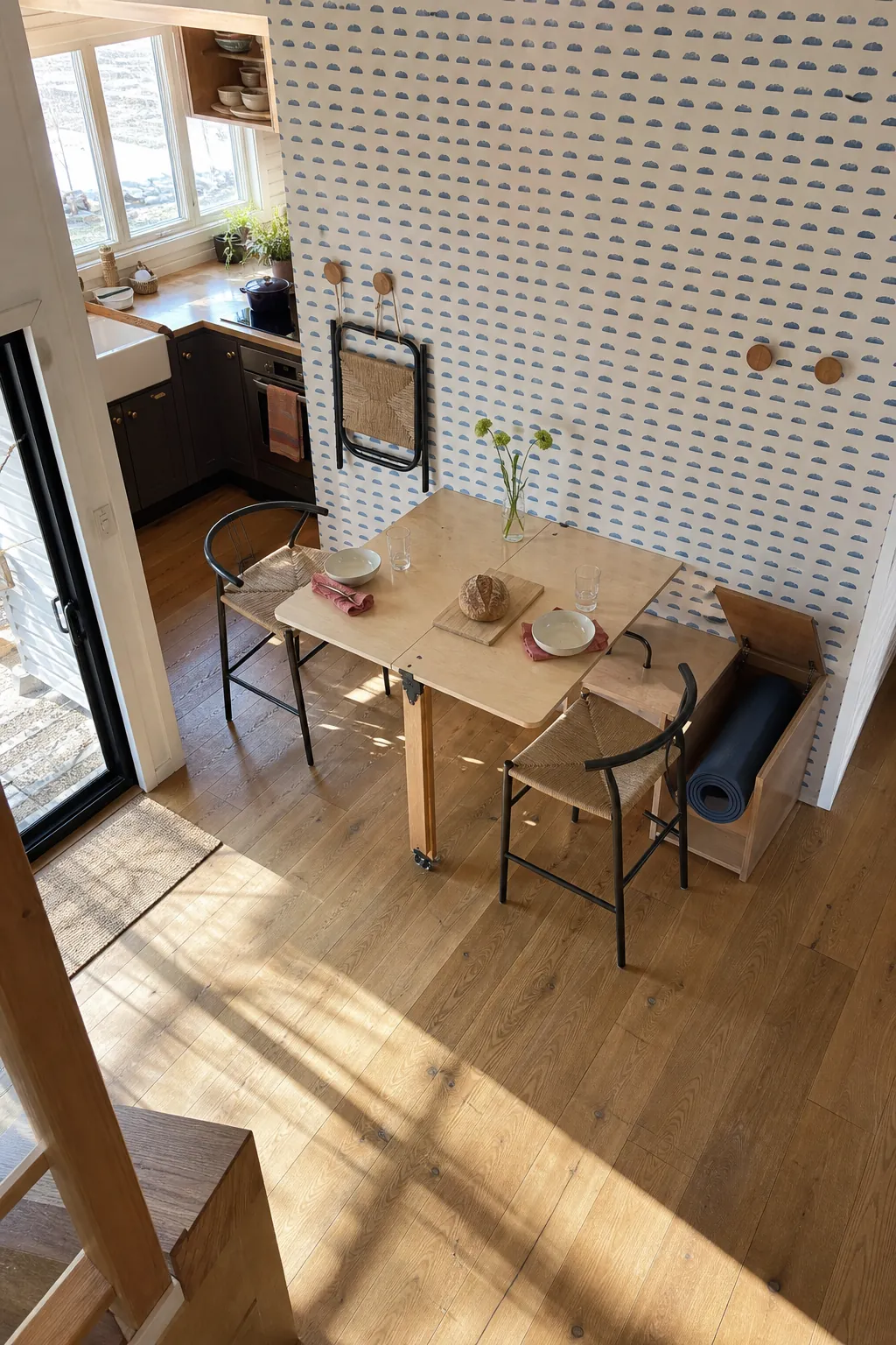 Fold-down dining table in a small tiny house with practical open floor space