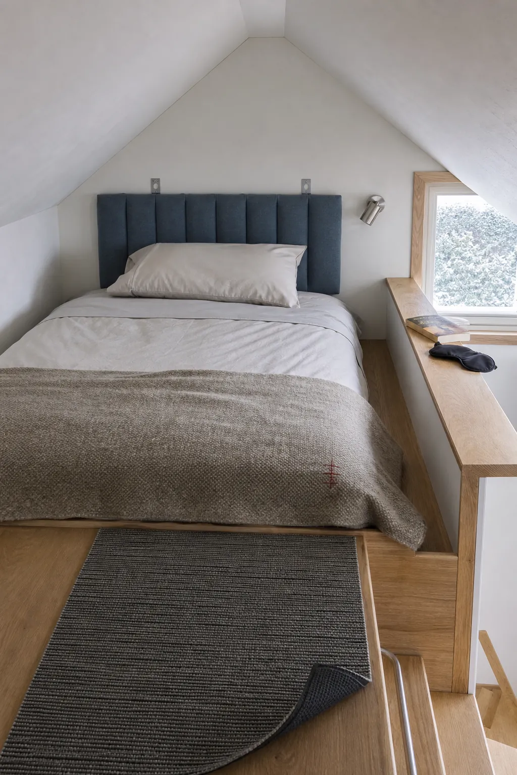 Breathable soft textures adding comfort without clutter in a tiny house loft