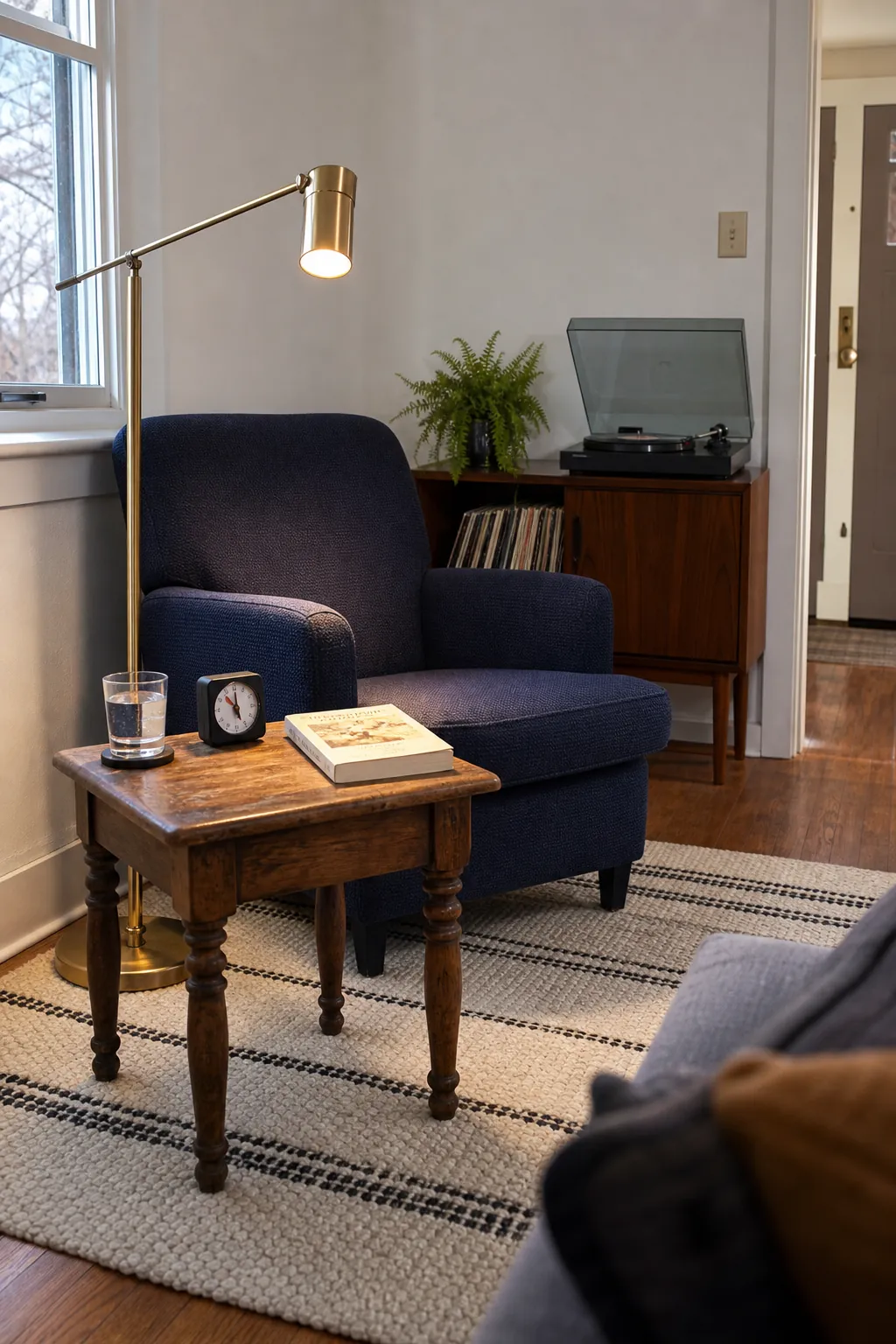 Mixed-era reading corner combining vintage and modern furniture