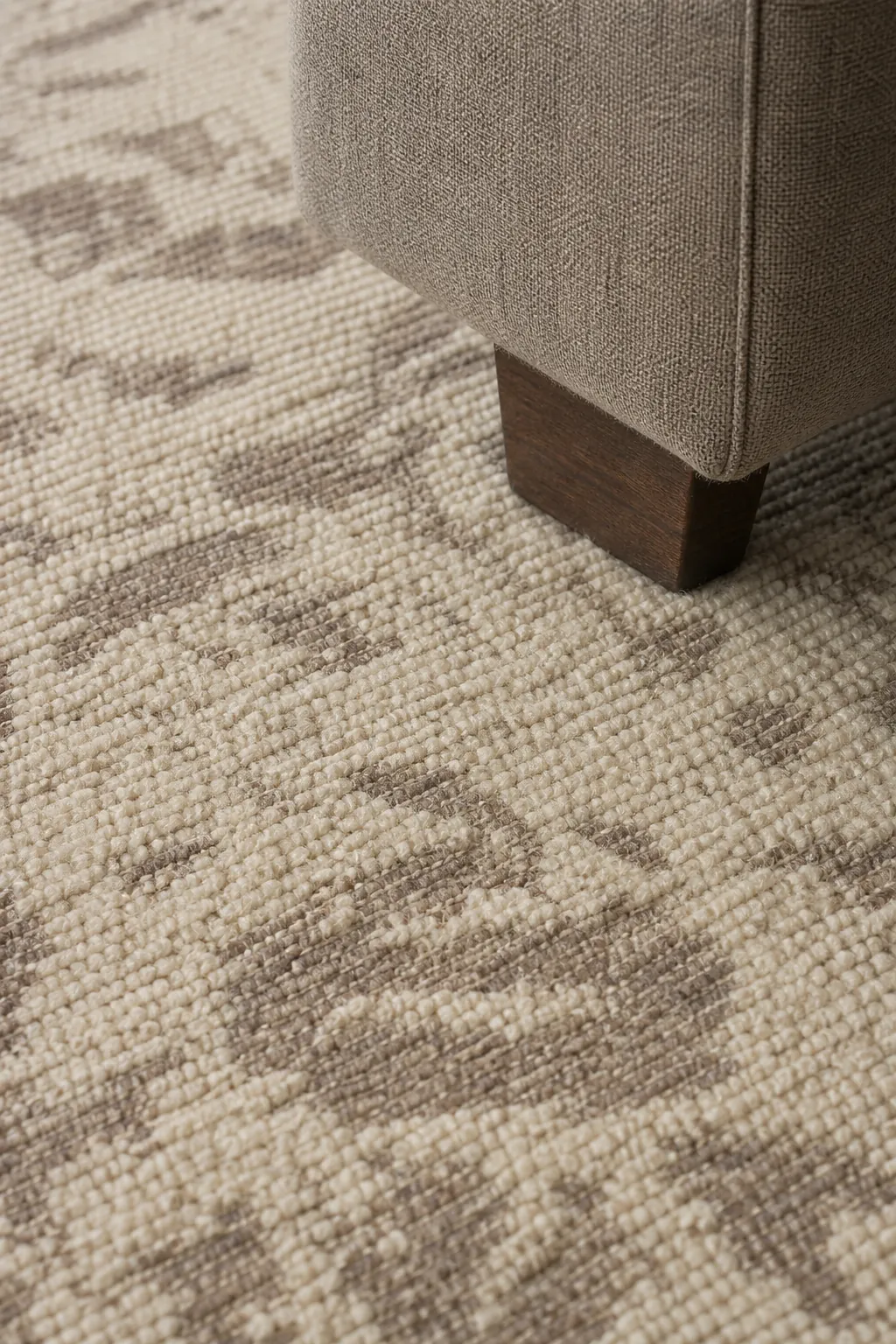 Detailed low-pile beige rug texture in natural light
