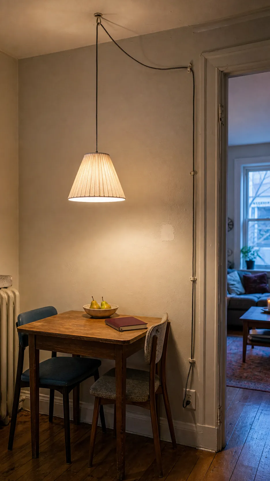 Plug-in pendant lighting a fixed small apartment dining nook