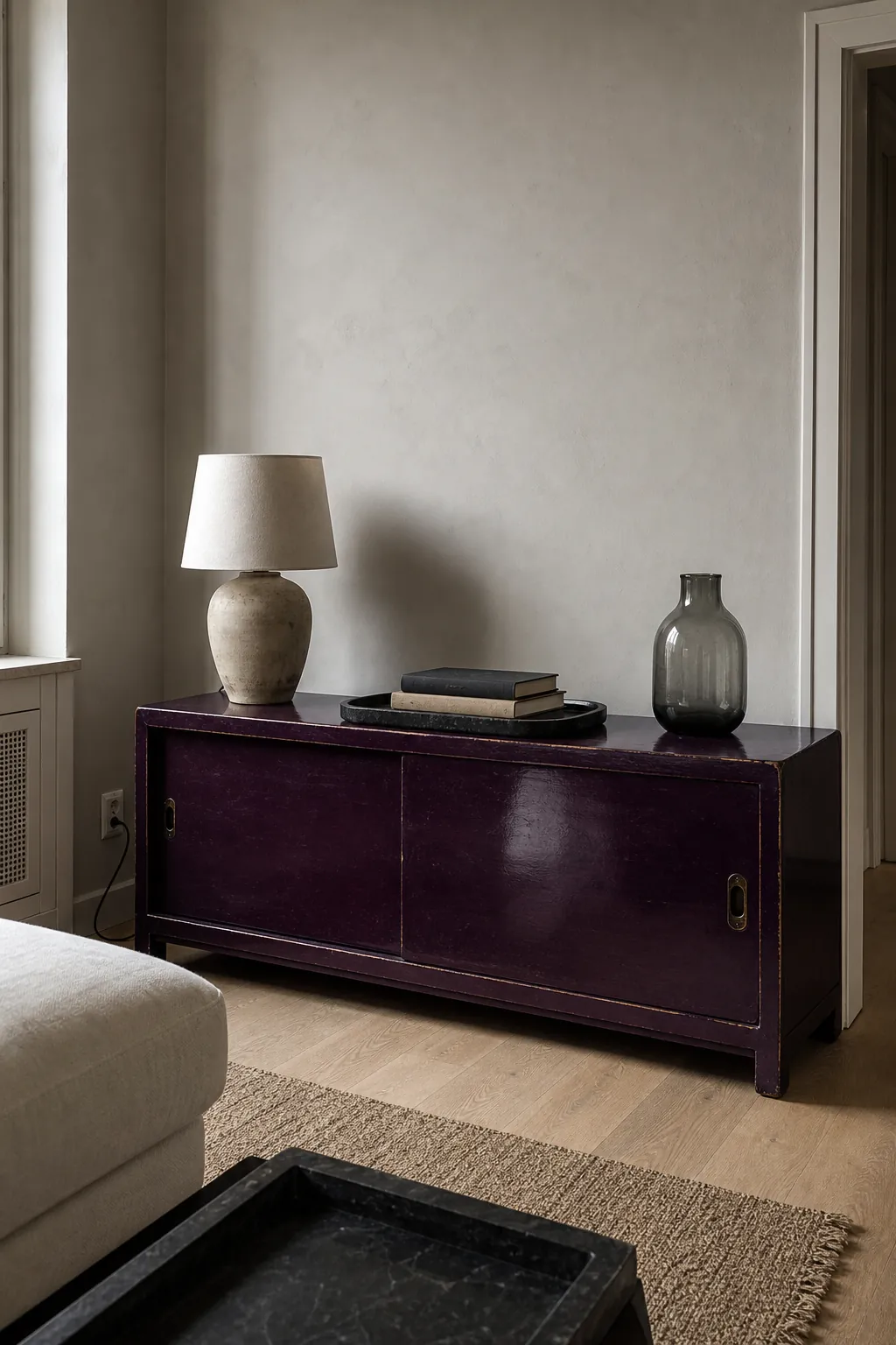 Aubergine lacquer cabinet in a modern Asian eclectic room