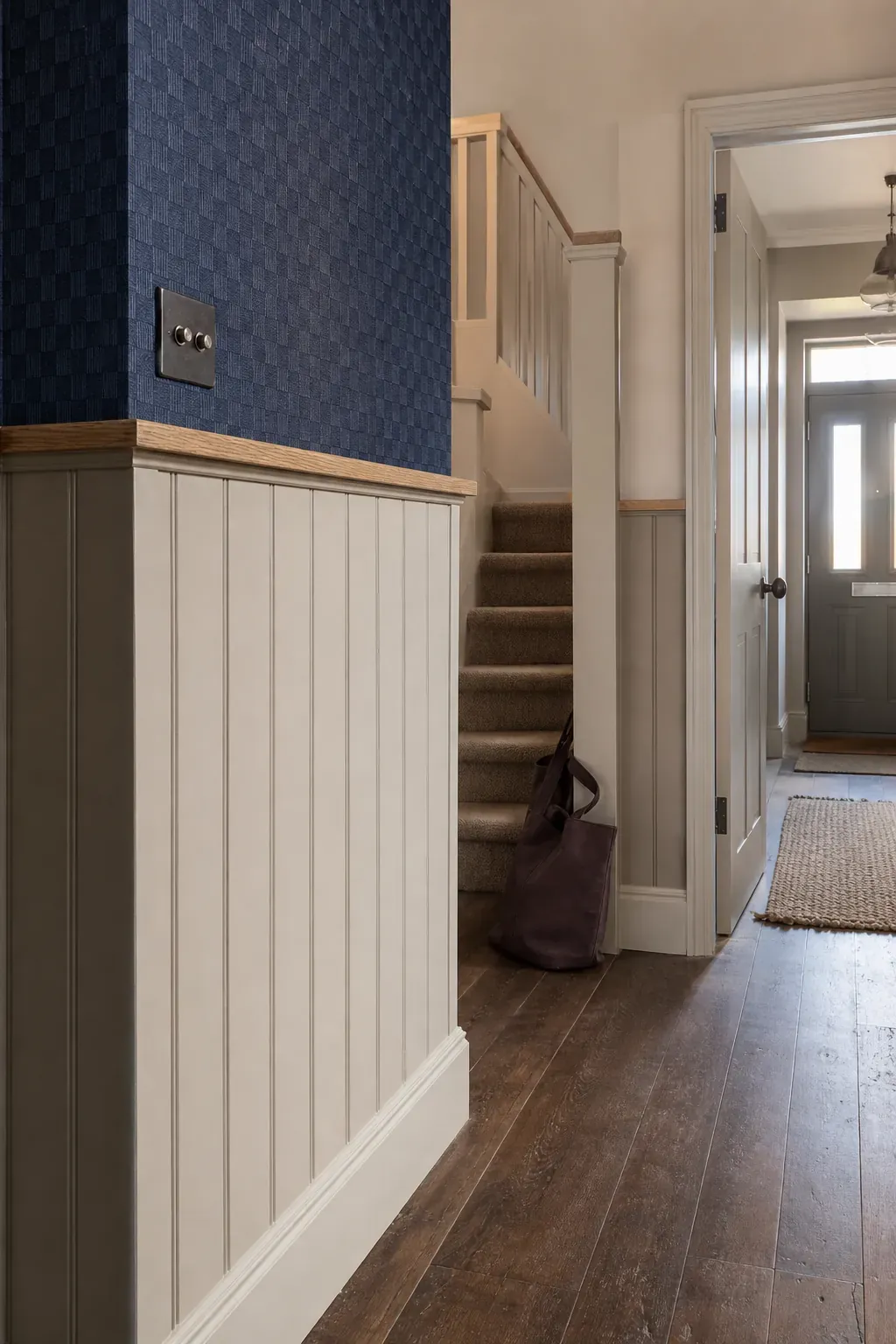 Warm half-height timber panelling in a contemporary hallway