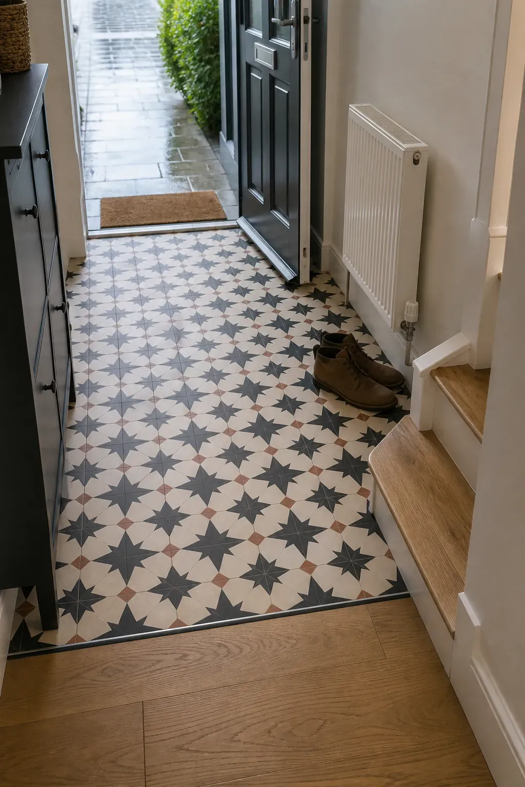 Patterned porcelain tile defining the entrance zone of a new build hallway