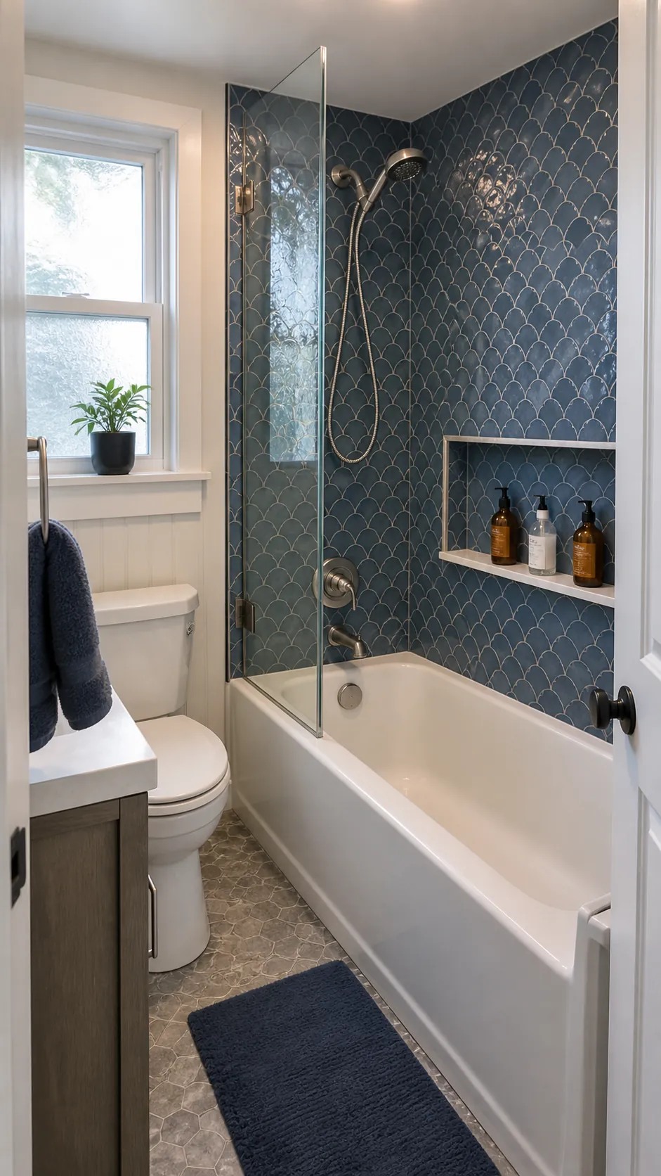 Recessed product niche above a small tub and shower combo