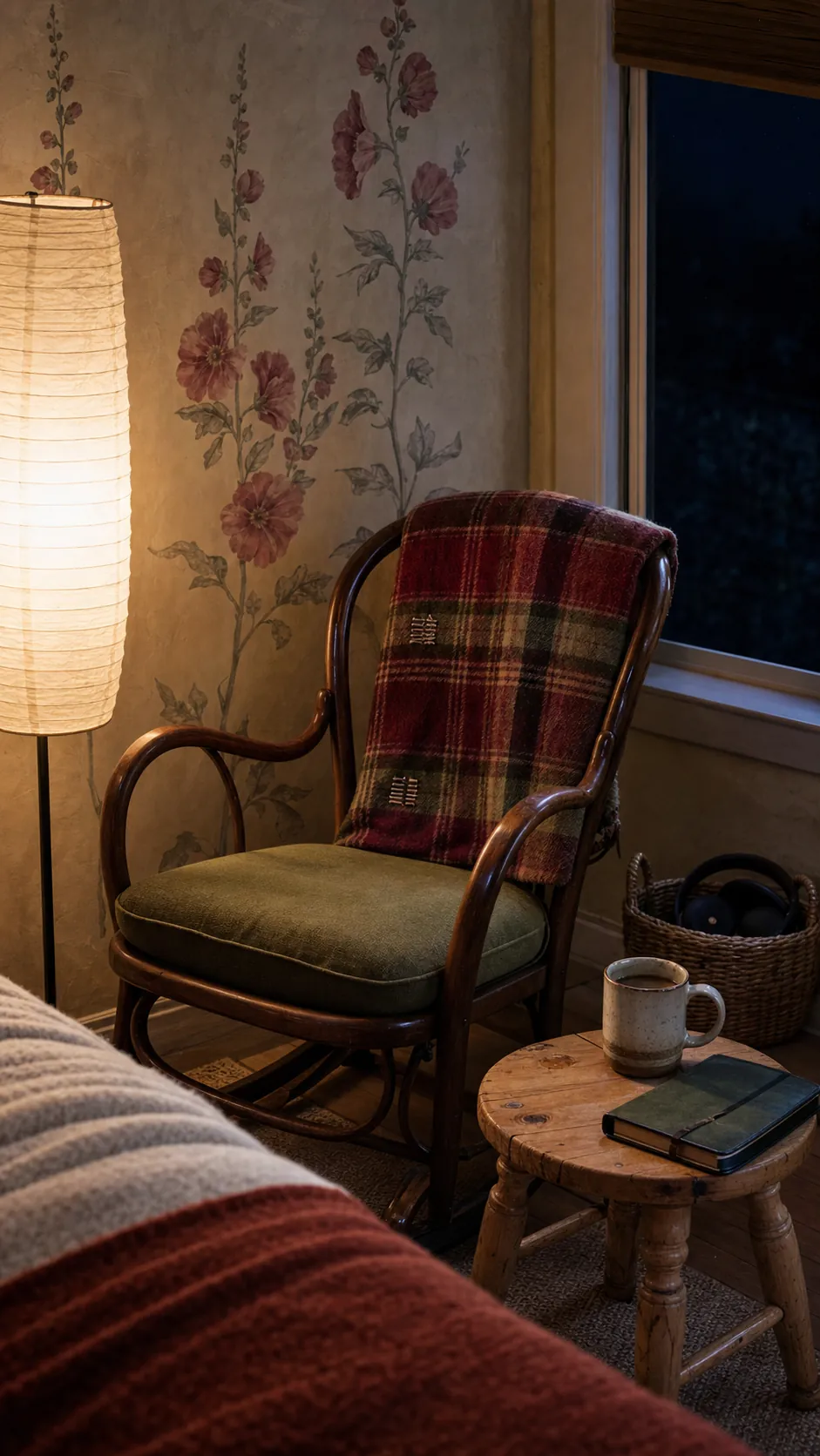 Warm reading corner shaped by personal vintage pieces and modern comfort