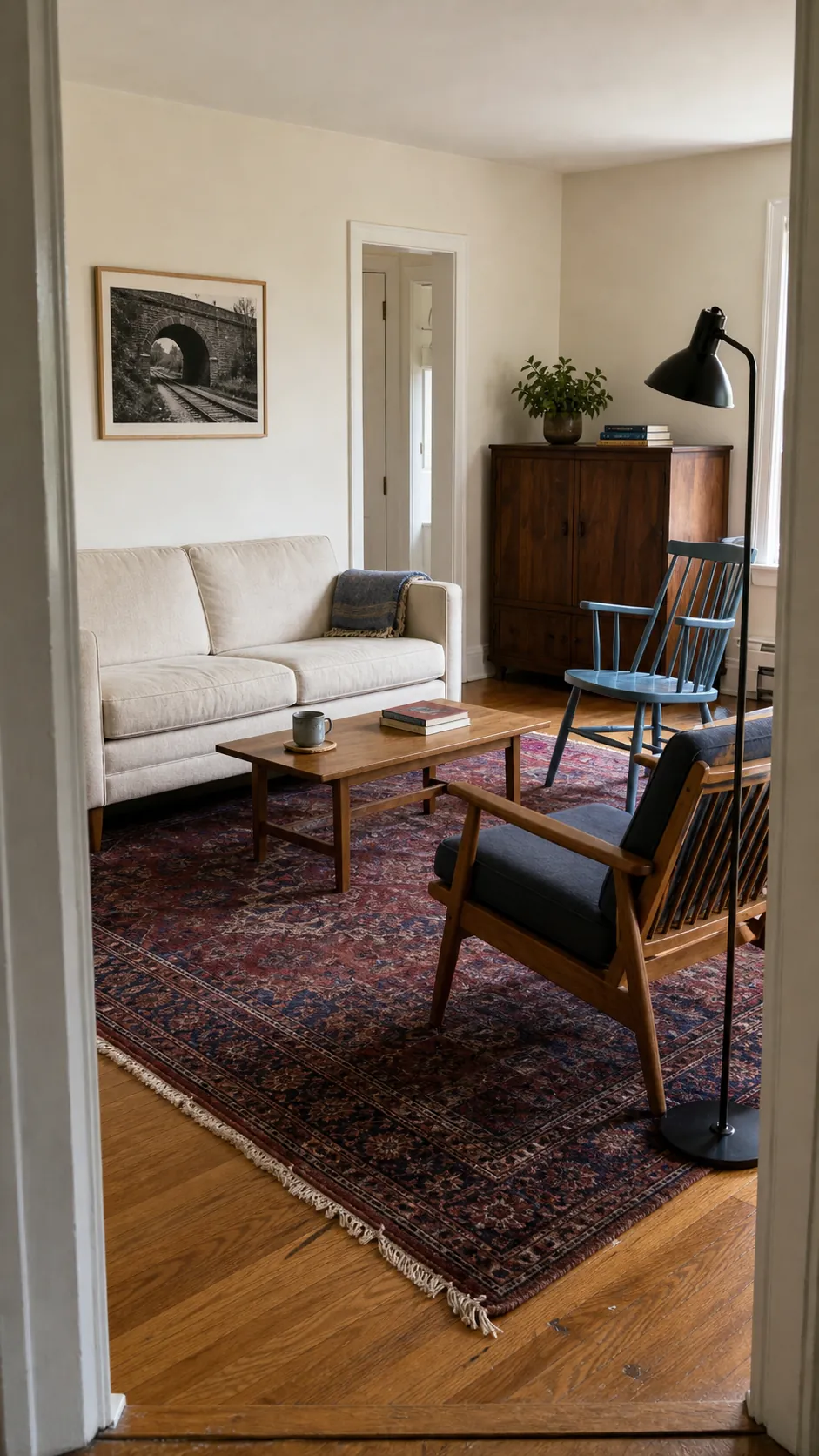 Thrifted living room arranged around a correctly sized rug and furniture