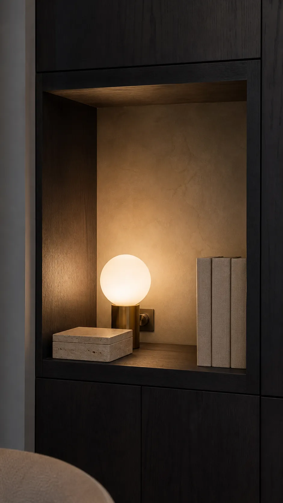 Opal globe lamp softly illuminating a deep wall niche